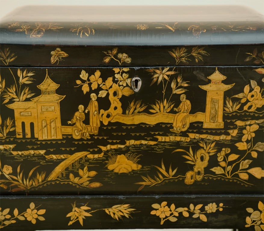 Chinese Export Box on stand in patinated lacquer with hand painted scenes showing people in a garden setting raised on square tapering legs.